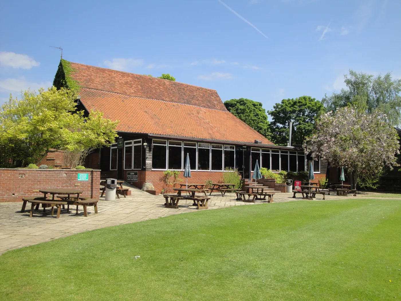 Clubhouse and outdoor seating at Alnesbourne Priory Golf Course, Nacton, Ipswich, Suffolk