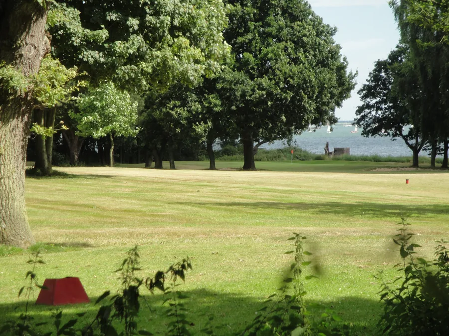 Tree-lined fairway at Alnesbourne Priory Golf Course near Ipswich, Suffolk
